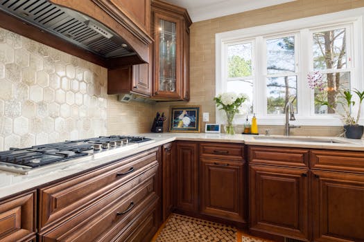 Elegant kitchen featuring classic wooden cabinetry and modern appliances, perfect for contemporary homes.