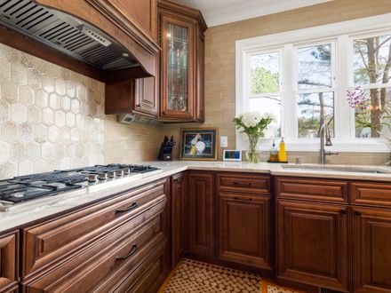 Kitchen backsplash tile being repaired