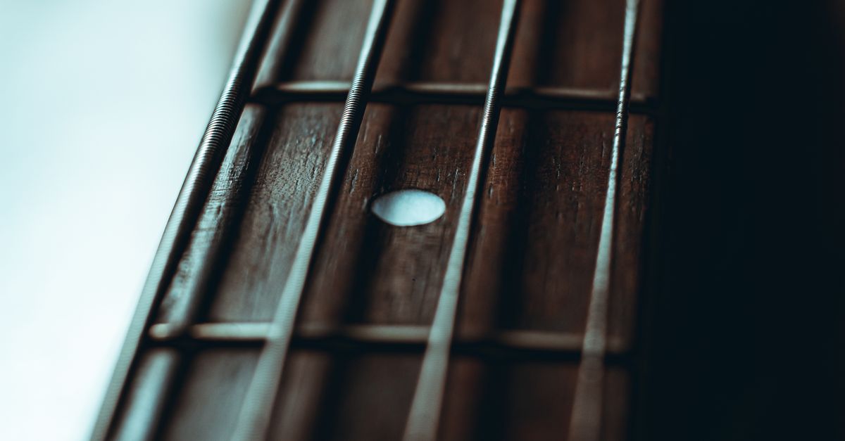 A Close-up Shot of a Guitar Strings · Free Stock Photo