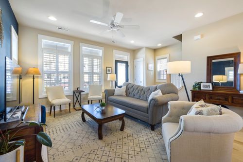 Free A modern and inviting living room with plush furniture, neutral tones, and ample lighting. Stock Photo