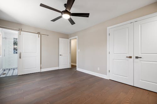 Inside of an Empty Room with a Ceiling Fan