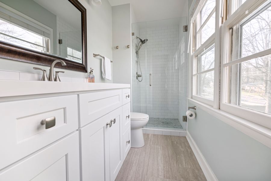 Modern bathroom with a frameless glass shower door