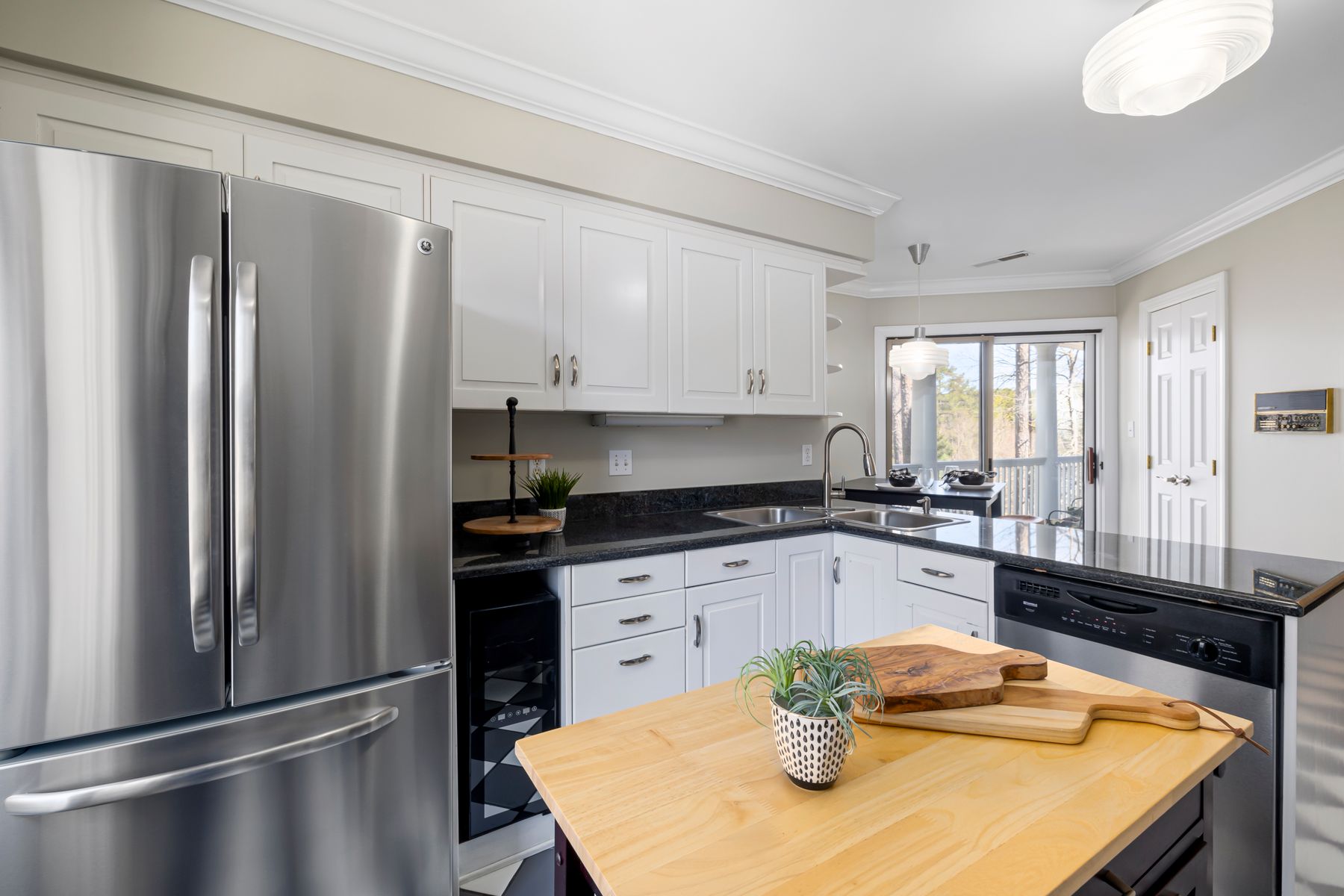 Stainless steel refrigerator in modern kitchen for GE appliance repair Dubai