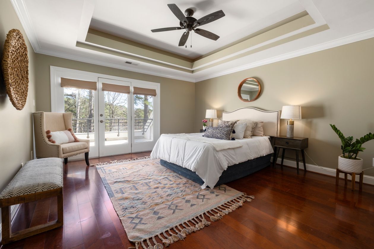 Bedroom with a large patterned rug under the bed