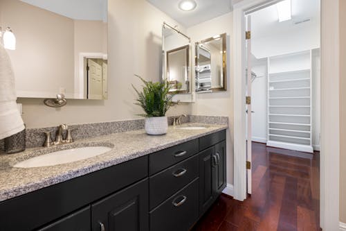 View of Empty Bathroom Interior with Sink and Mirrors