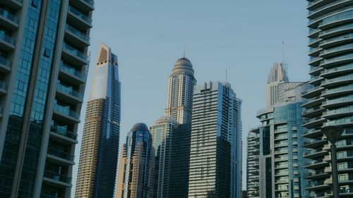 Free A view of modern high-rise skyscrapers under a clear sky, capturing an urban landscape. Stock Photo