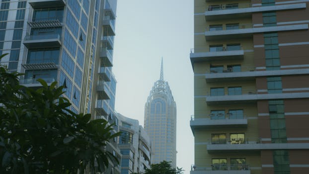 Captivating view of Dubai's modern skyline featuring iconic skyscrapers amidst a clear blue sky.
