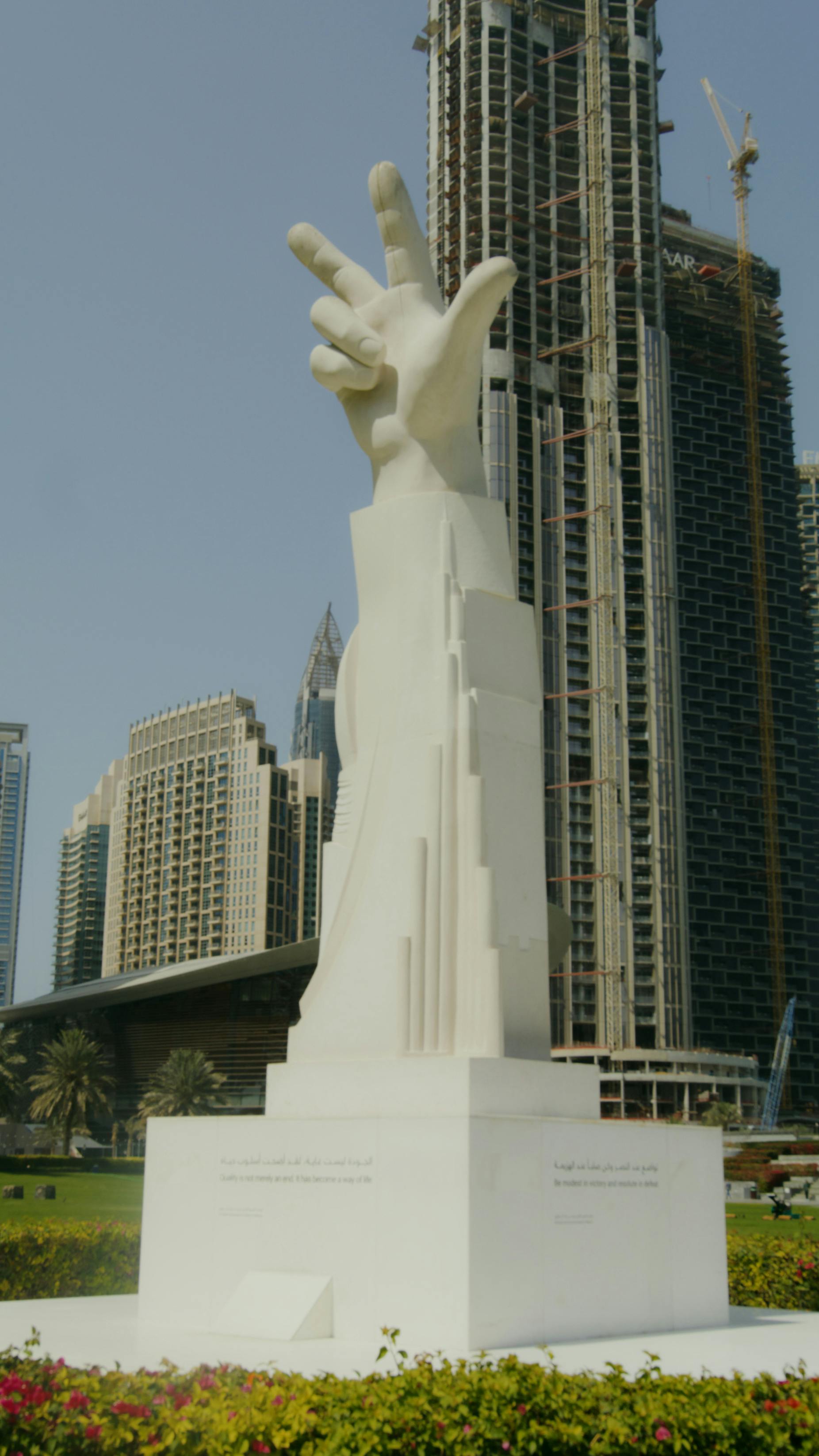 a statue of a hand with three fingers salute