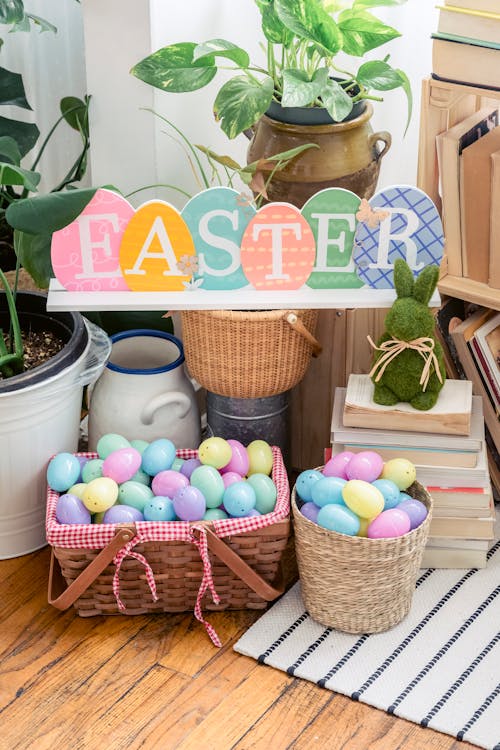 Easter title over decorative hare and bucket with basket full of colorful eggs in light house