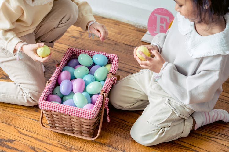 Multiethnic Preschool Funny Girl Sharing Plastic Eggs From Basket