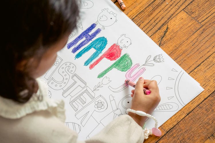 Kid Painting Inscription Happy Easter In Coloring Book