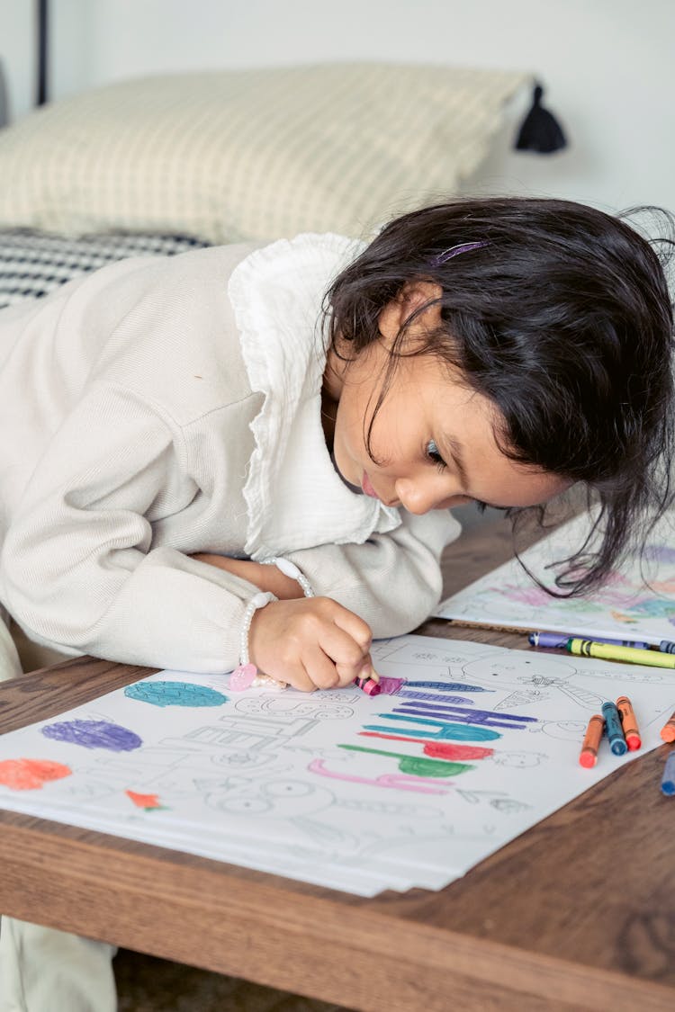 Focused Ethnic Girl Painting Picture For Easter