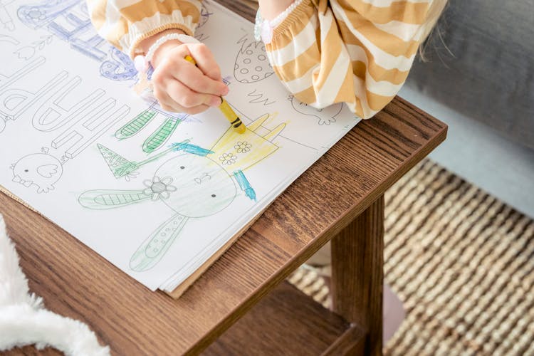 Girl Drawing Picture For Catholic Easter Celebration