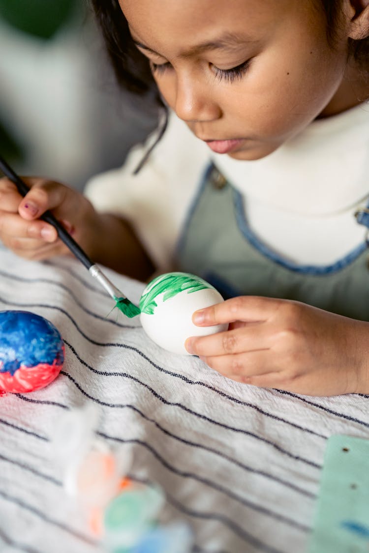 Girl Painting Egg