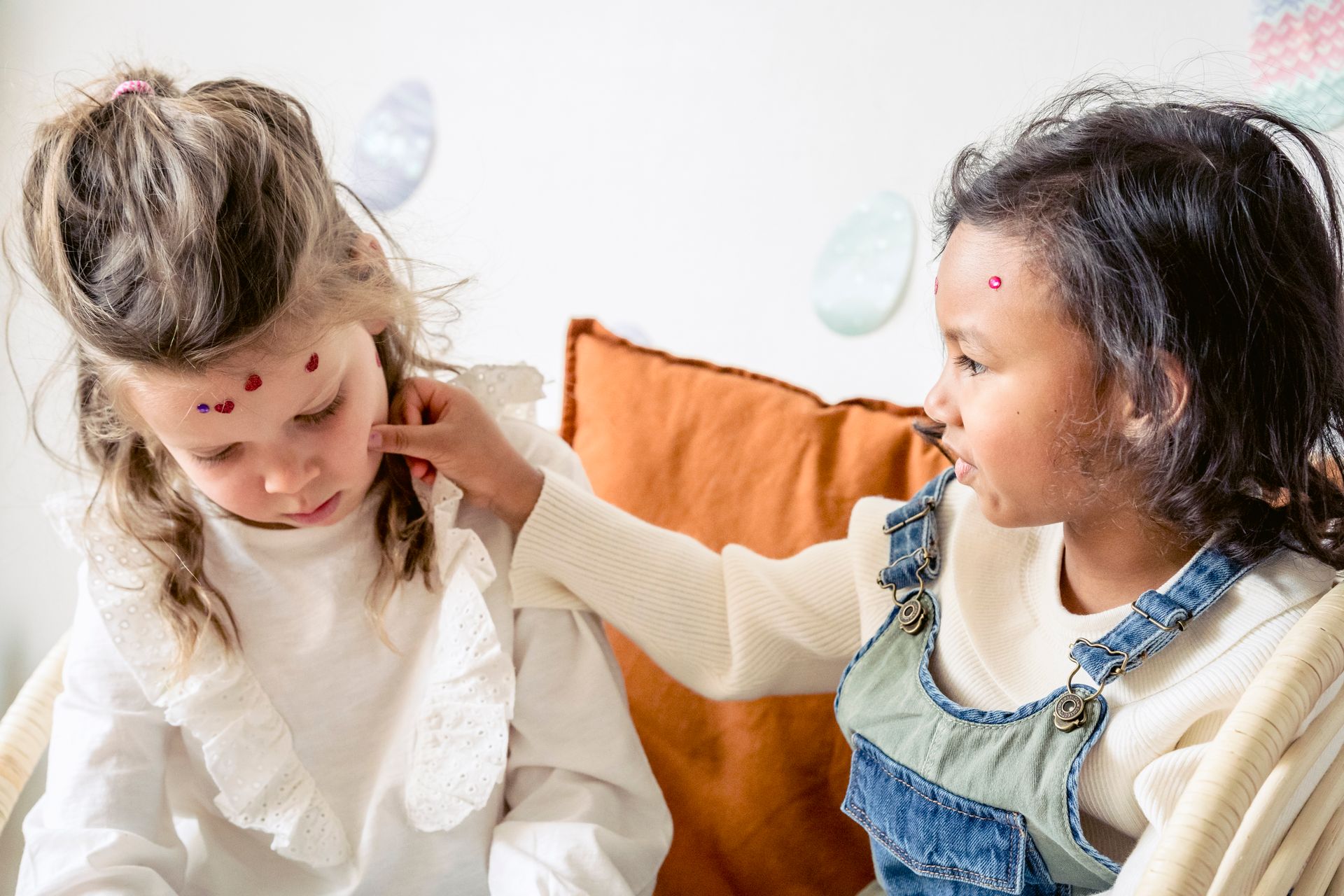 Multiethnic children having fun with stickers