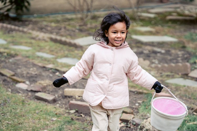 Cute Hispanic Girl Playing Egg Hunt