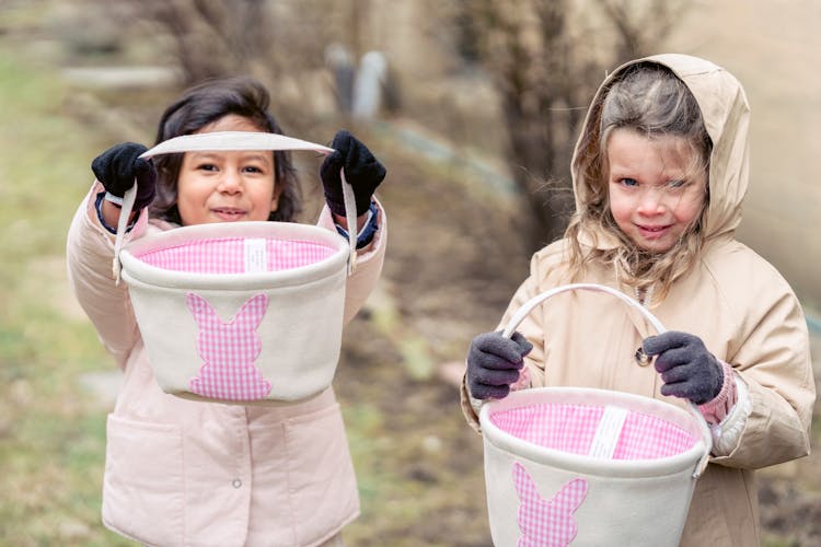 Diverse Girls Playing Egg Hunt Game On Street