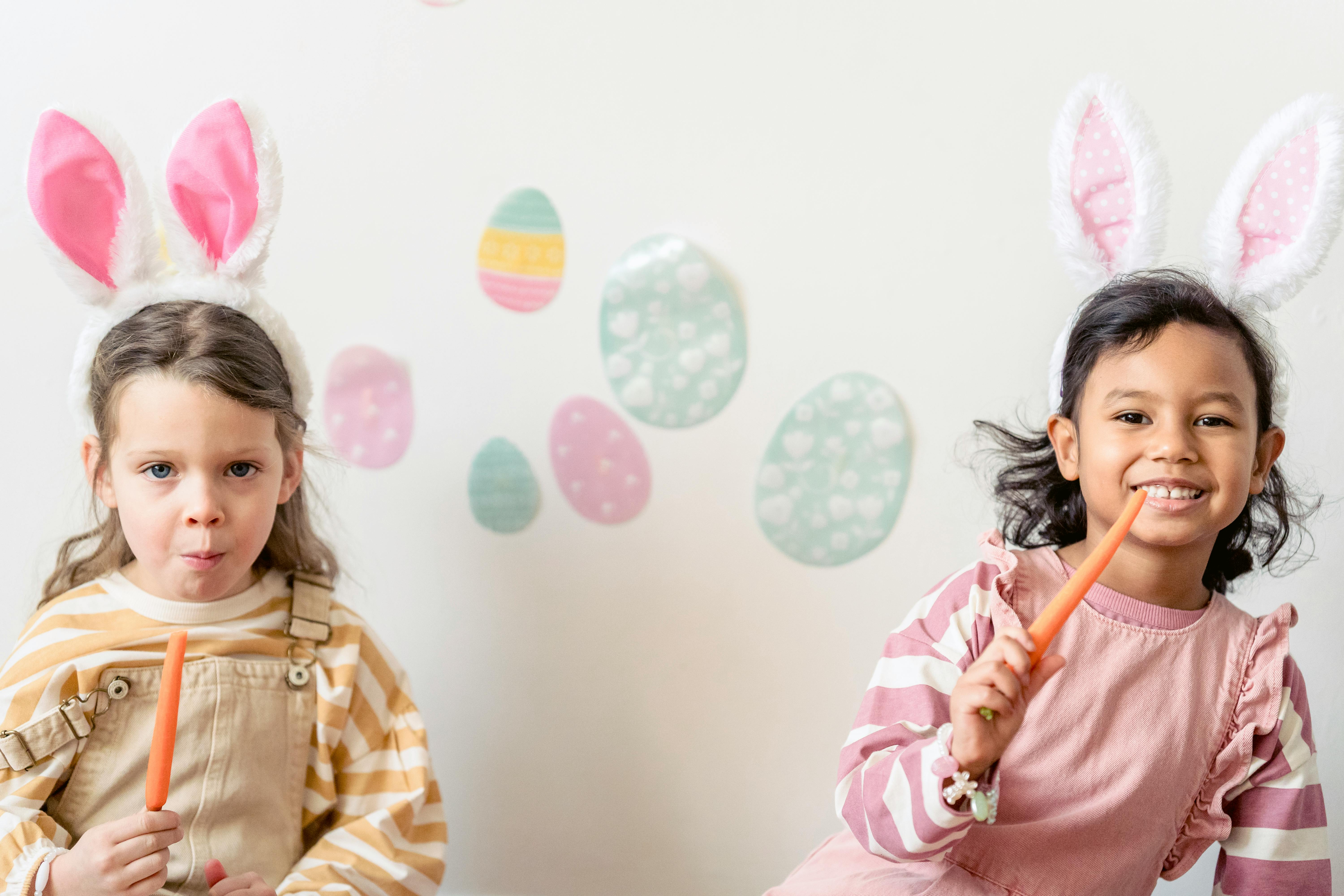 Children creating crafts in a holiday workshop setting with festive decorations.