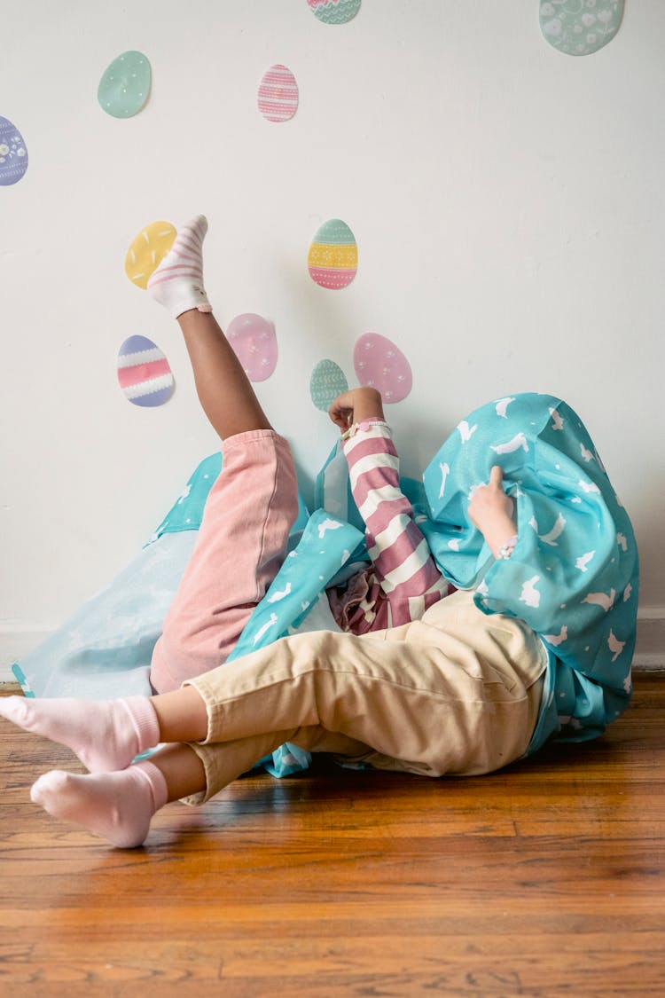 Anonymous Children Playing On Floor