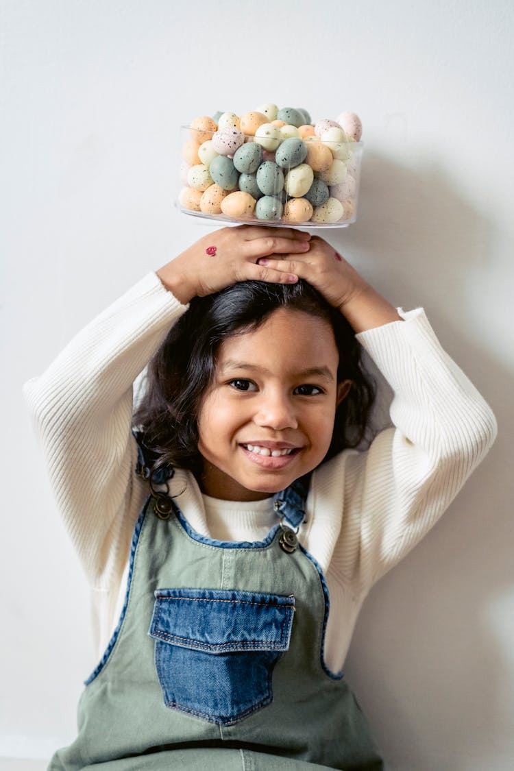 Cute Girl With Colorful Plastic Easter Eggs