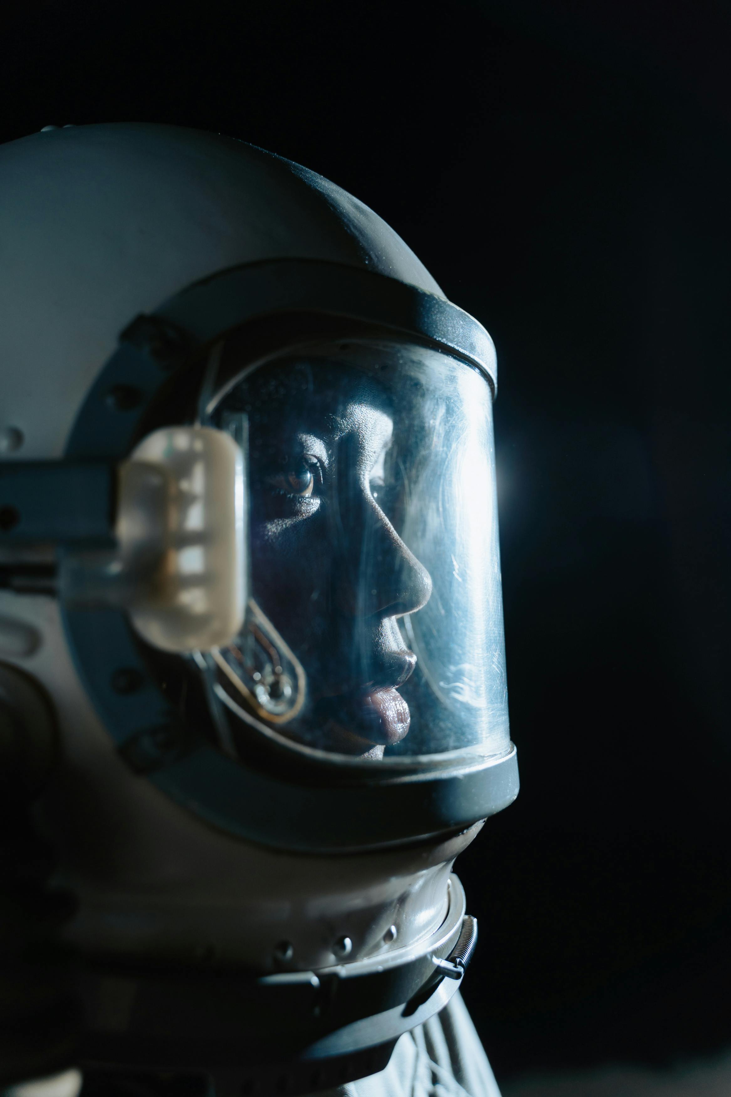 close up photo of a person wearing space helmet