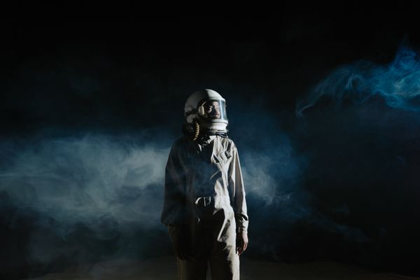 Astronaut standing in drifting haze — photo by cottonbro studio on Pexels