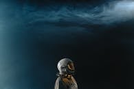 Person Wearing Space Suit and Helmet in Outerspace