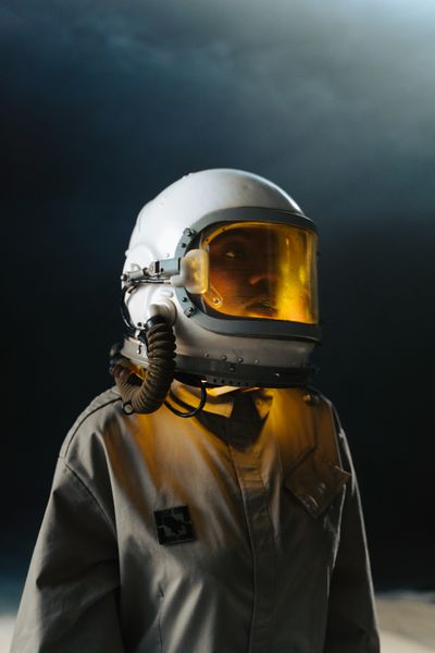 Amber-visor pressure suit — photo by cottonbro studio on Pexels