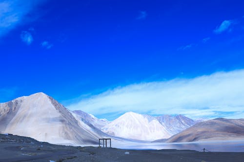 Free Snow Covered Mountains Under Blue Sky Stock Photo