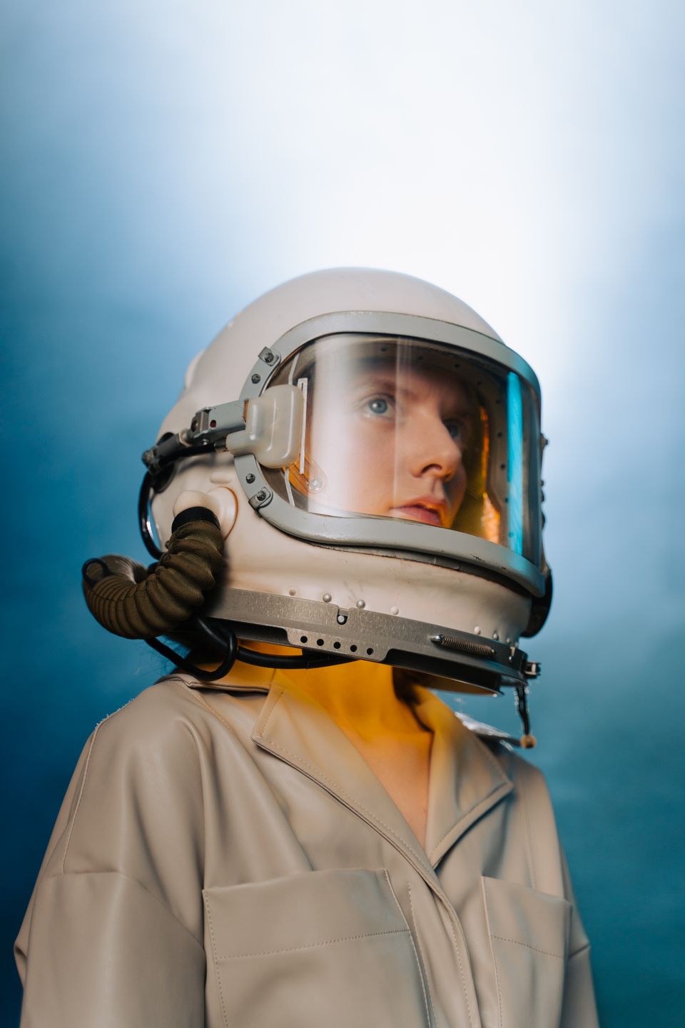 Space-suit portrait with a dark cinematic background