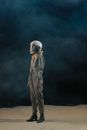 Person in White Hoodie Standing on Brown Sand