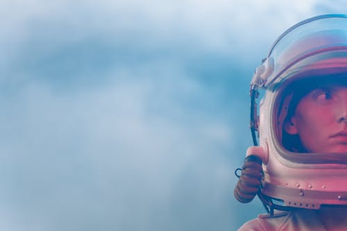 Woman Wearing a Space Suit and Helmet