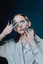 Woman with Silver Sparkles on Her Hand and Body