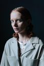 Woman Wearing Button Down Coat with Silver Sparkles on Her Head and Body