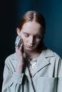 Woman Wearing Button Down Coat with Silver Sparkles All Over Her Body