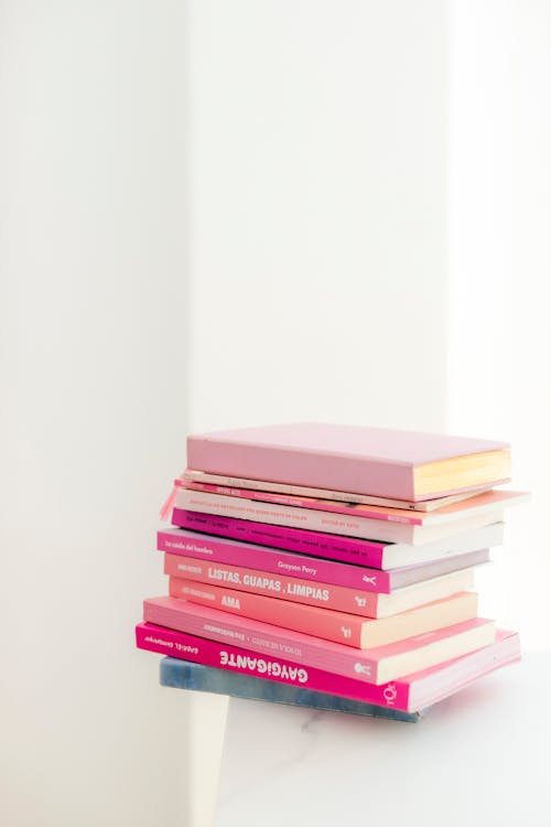 Free Stack of Books on White Table Stock Photo