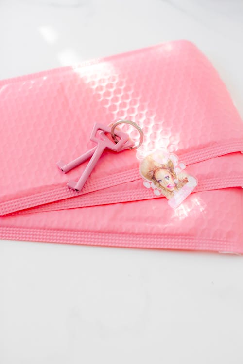 Free Pink Bubble Pouch With Silver Keys Stock Photo