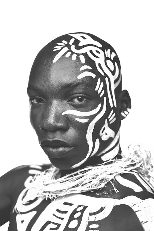 The Art Face. Black and white body paint on african woman