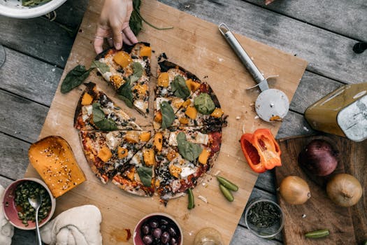 Delicious vegan pizza topped with fresh vegetables, captured in a flat lay style for appetizing appeal.