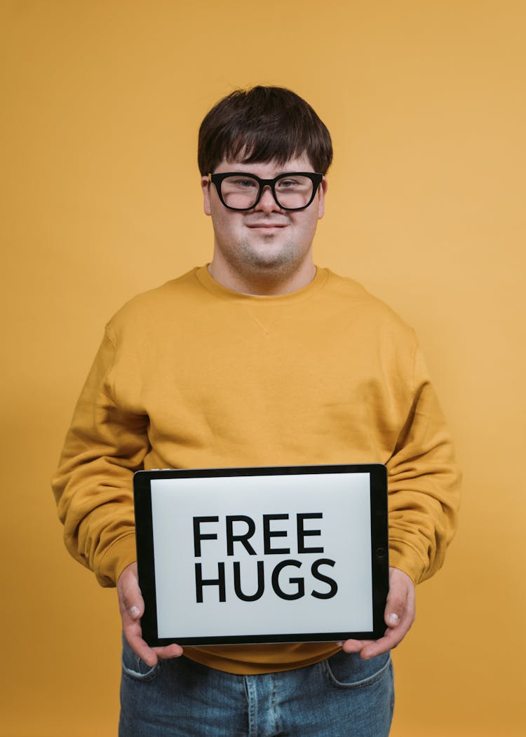 Man In Yellow Sweater Smiling