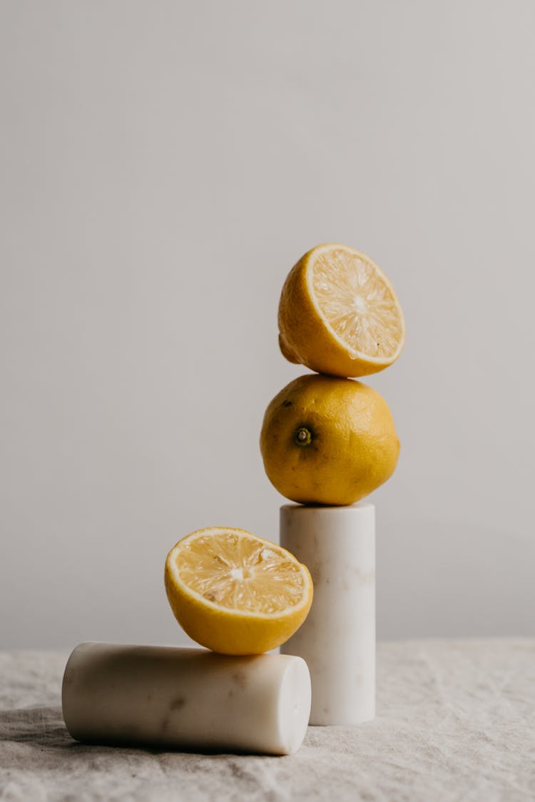 Sliced Lemon On White Surface