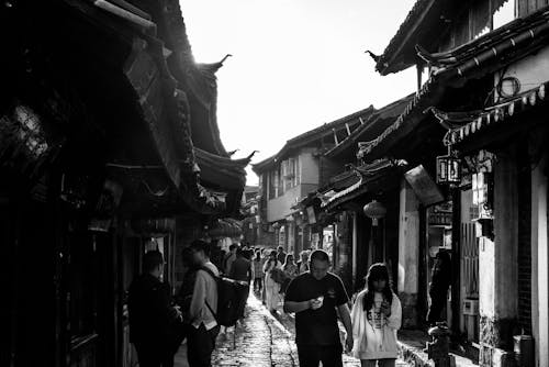 Grayscale Photo of People Walking on Street