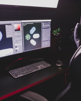 A stylish computer desk setup featuring dual monitors, keyboard, mouse, and plant decor, ideal for tech enthusiasts.