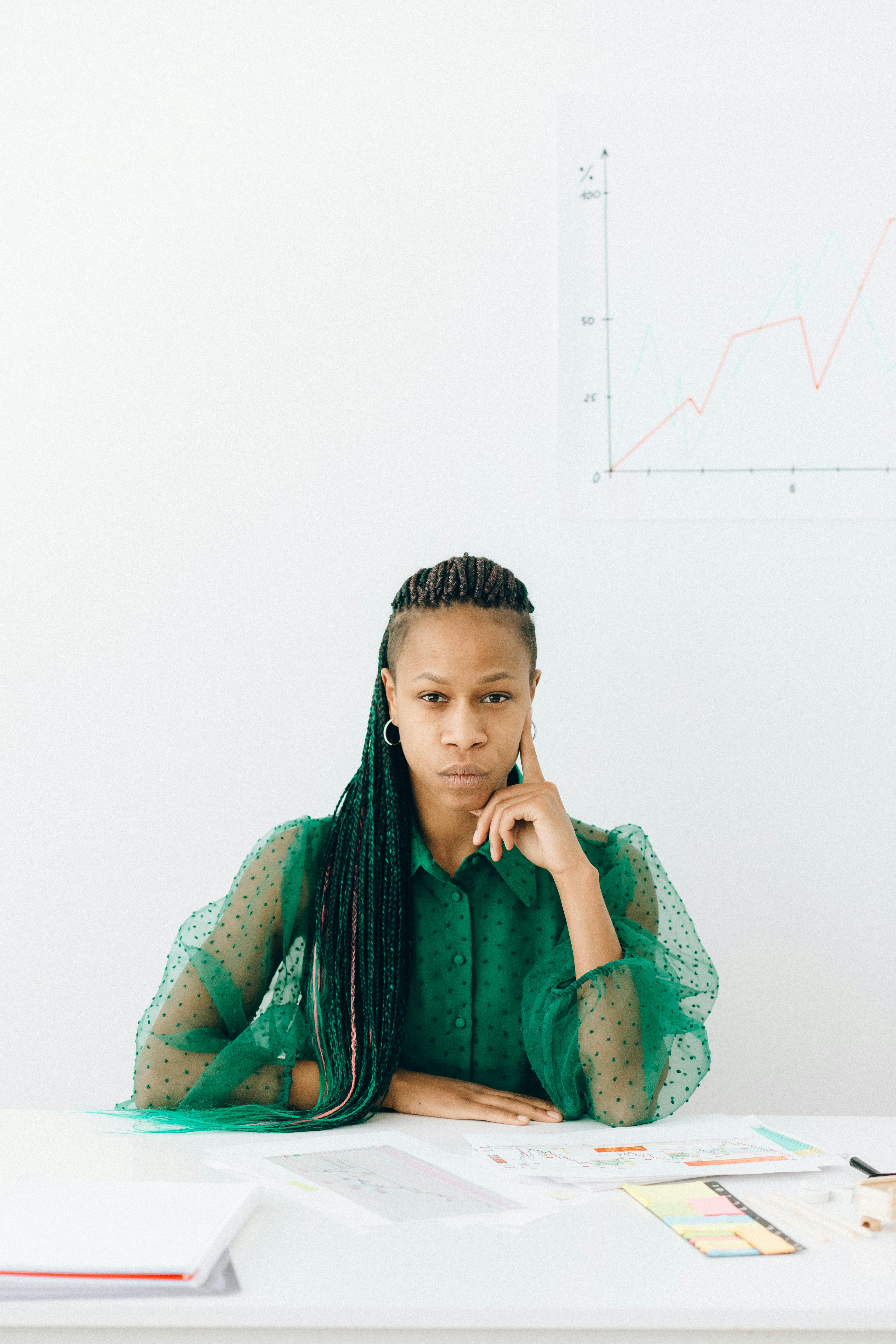 photograph of a woman in a green top