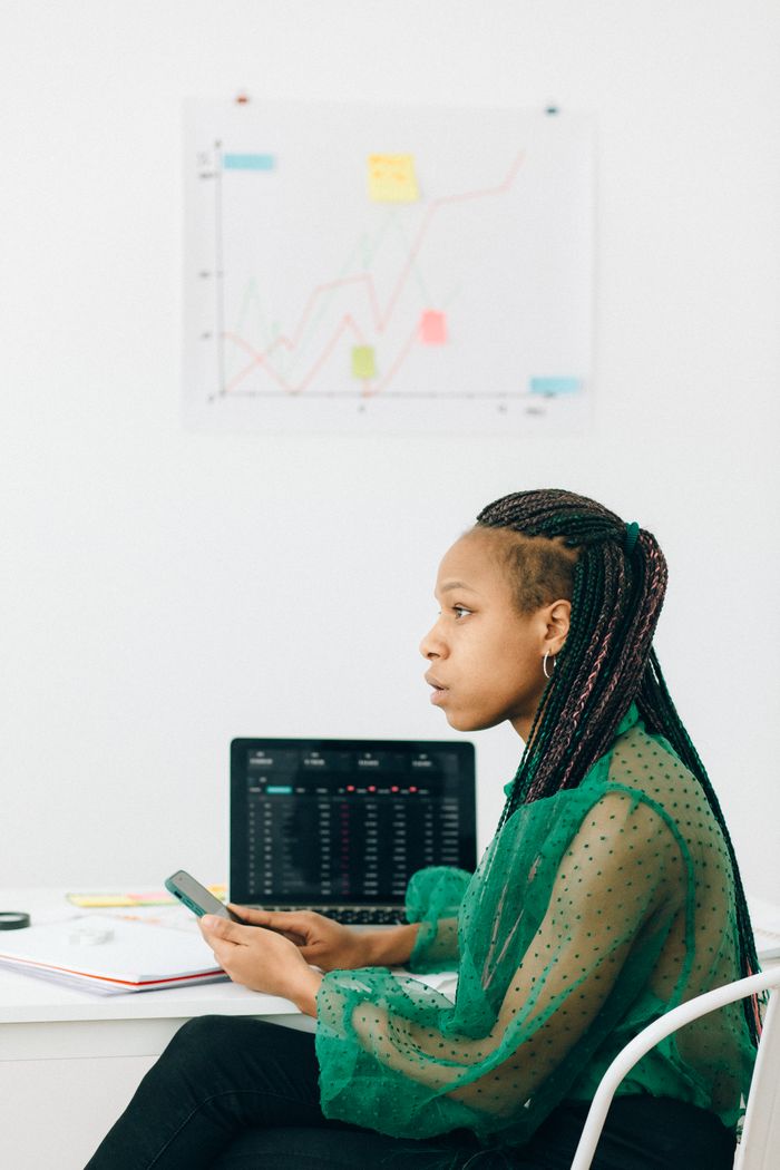 Analyst reviewing a business data dashboard on screen