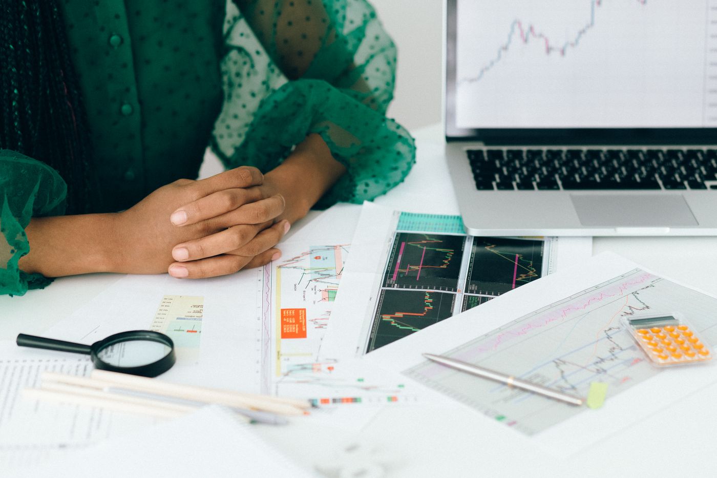 Black woman reviewing financial charts that can influence credit scores