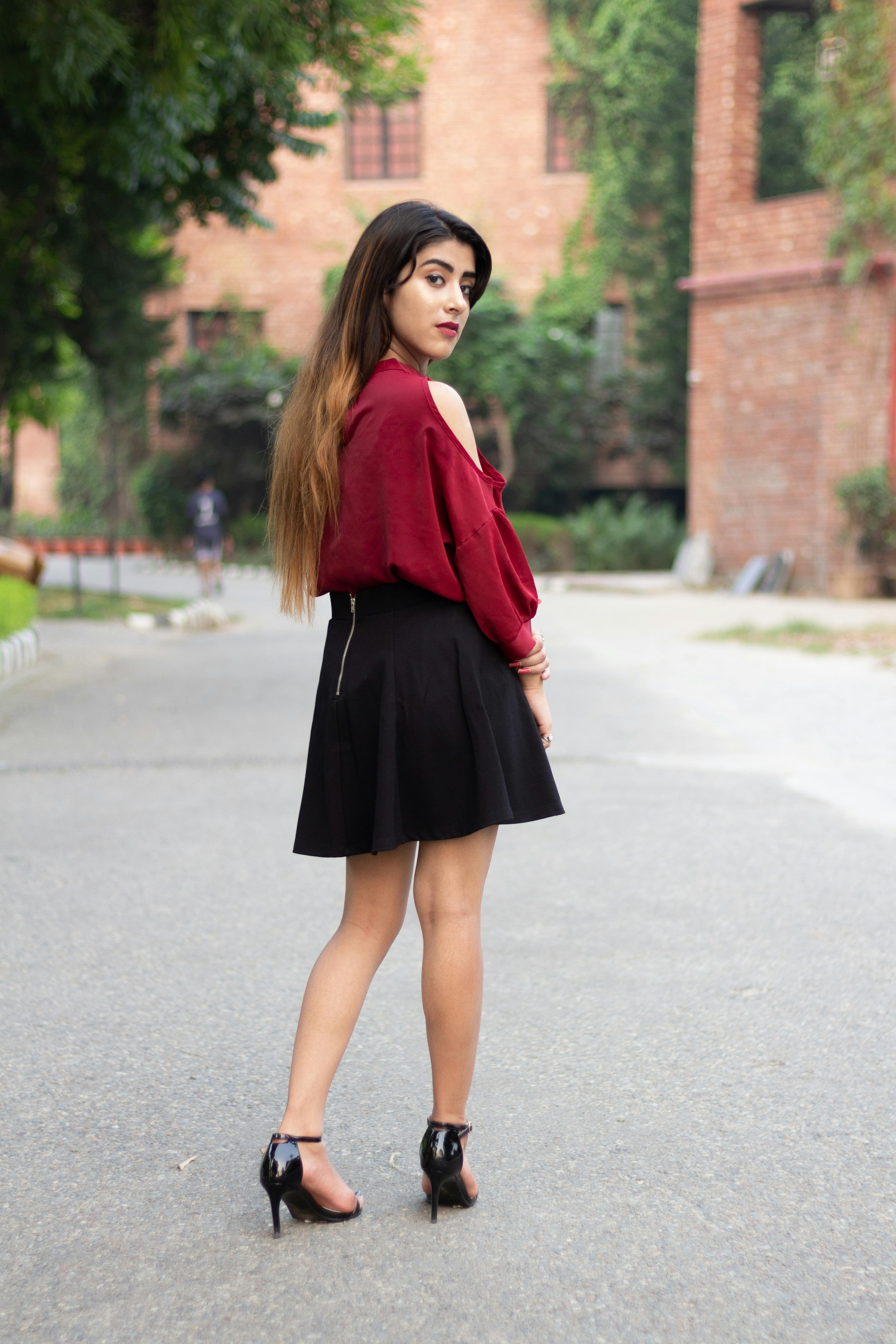 A Woman in Red Blouse Black Skirt · Free Stock Photo