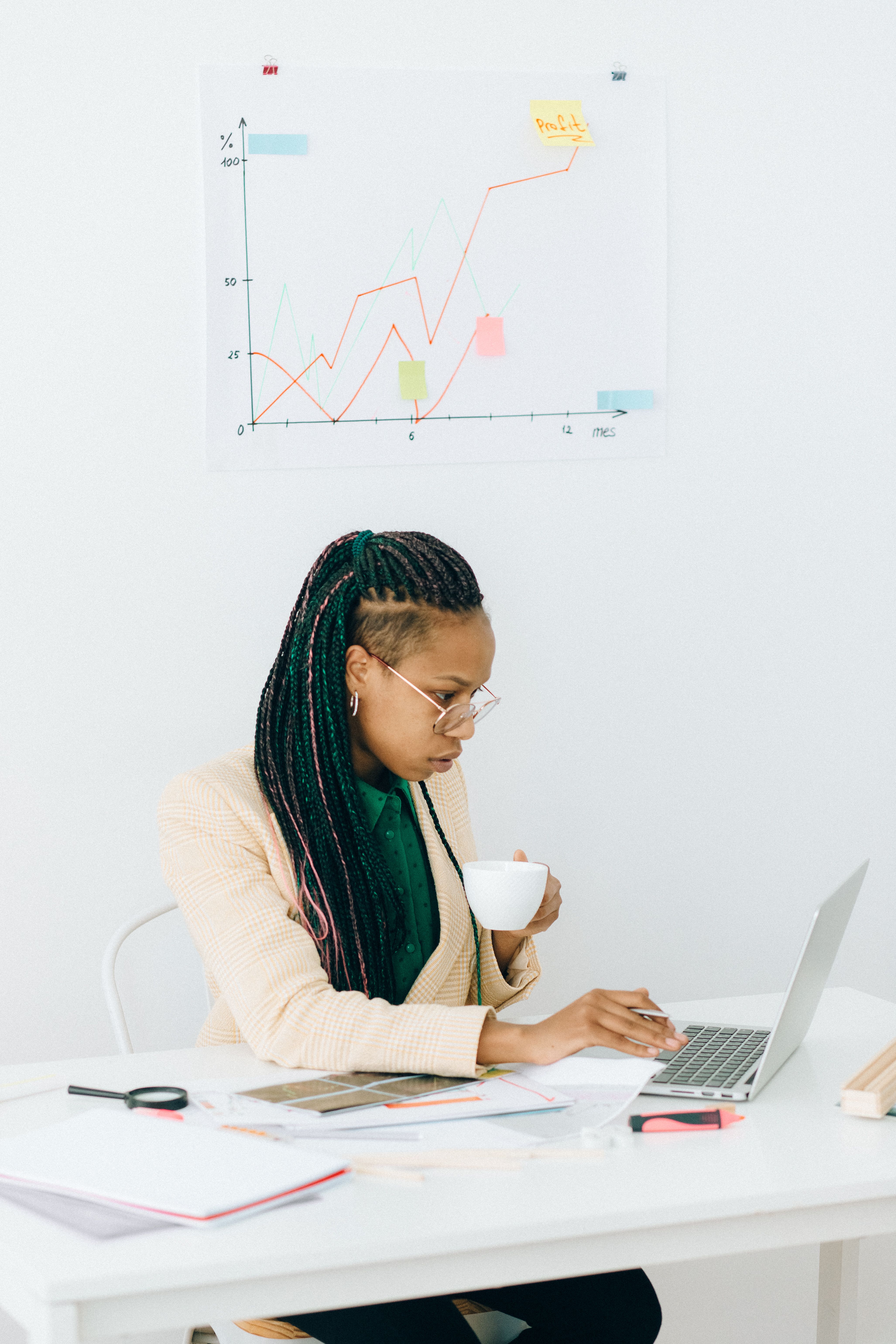 a woman in business suit working in her office
