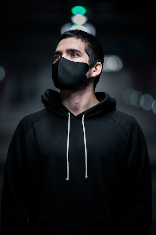 Man in Black Jacket Wearing Black Mask