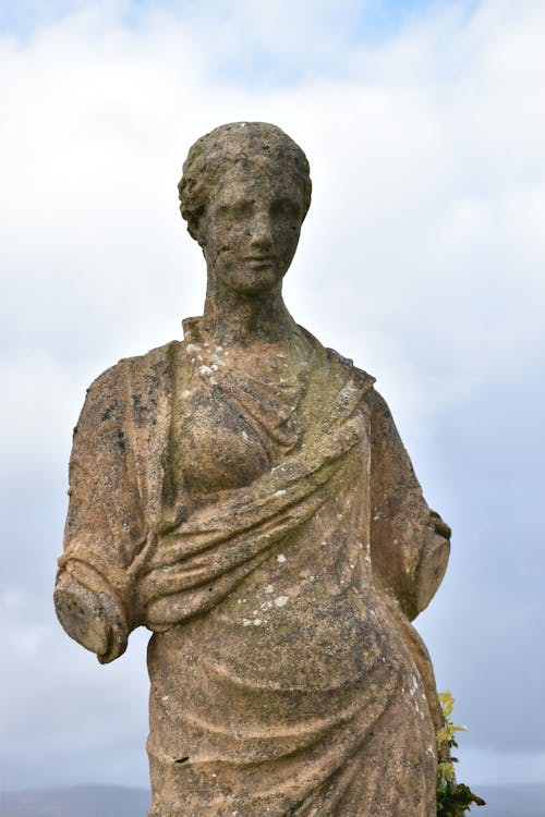 Weathered Statue Cloudy Sky Background